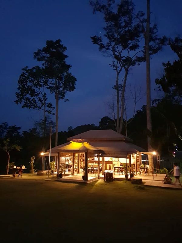 Lighted dining cabin during night time. 