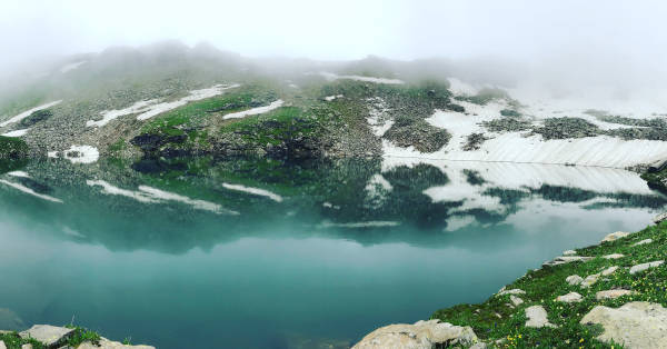 The waters of Bhrigu Lake is crystal clear providing the perfect mirror image.
