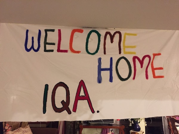 A photo of a banner saying " welcome home iqa" when Atiqah paid her family in Saudi a visit.