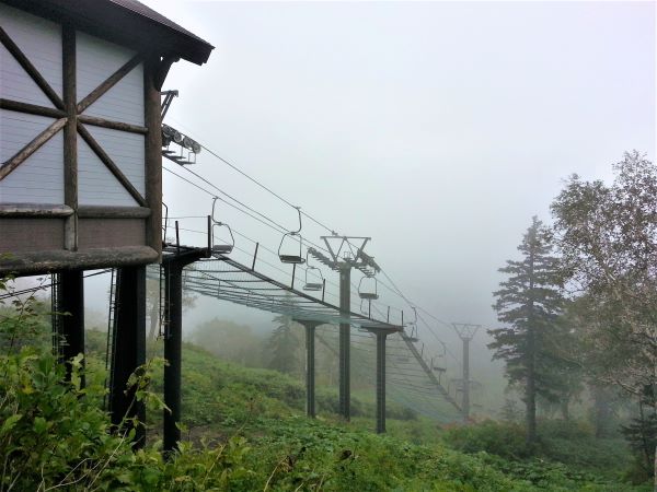Seventh Station at Mount Kurodake showing chair lifts shrouded in a thick mist.