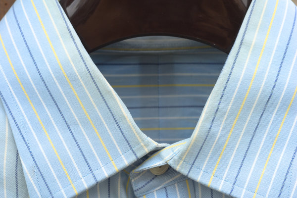 Close-up on the collar of the blue striped shirt, showing the not-so-apparent yellowing along the collar fold.