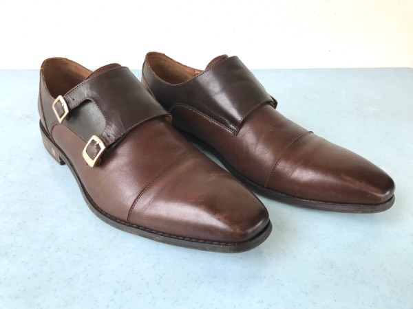 Brown, double monk-strap shoes.