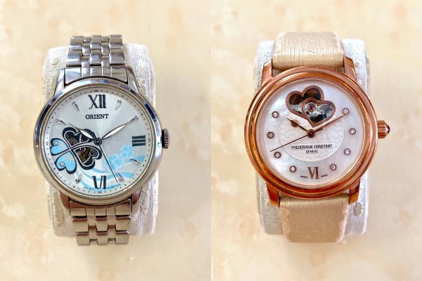 Close-up of Orient Clover and Frédérique Constant Double Heartbeat, showing the typical ladies' watch design.