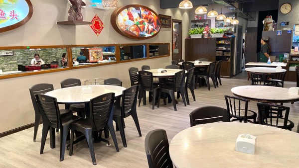 View of the dining area of Michele's Kitchen, showing wide open spaces, to mimic home dining experience.