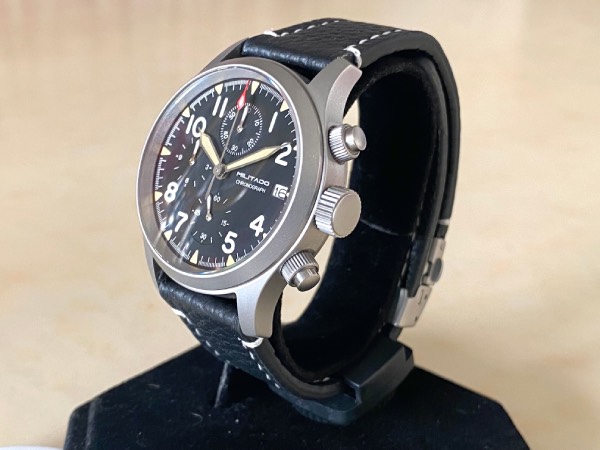 Close-up of the Militado ML1868 field watch with a black leather strap.