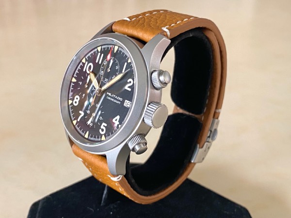 Close-up of the Militado ML1868 field watch with a brown leather strap.